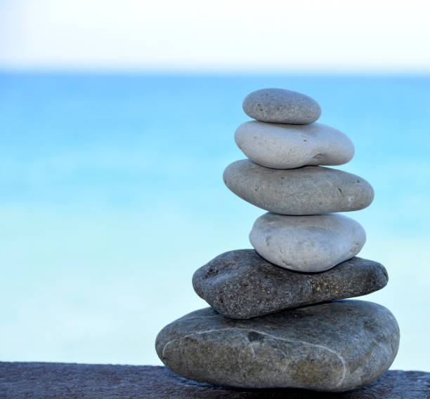 istock stone tower on the beach - stones stacked on each other 822650756