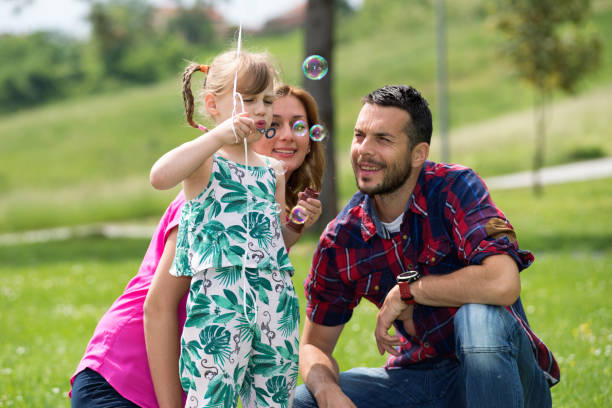 istock Young parents and his daughter,enjoy in park 822651604