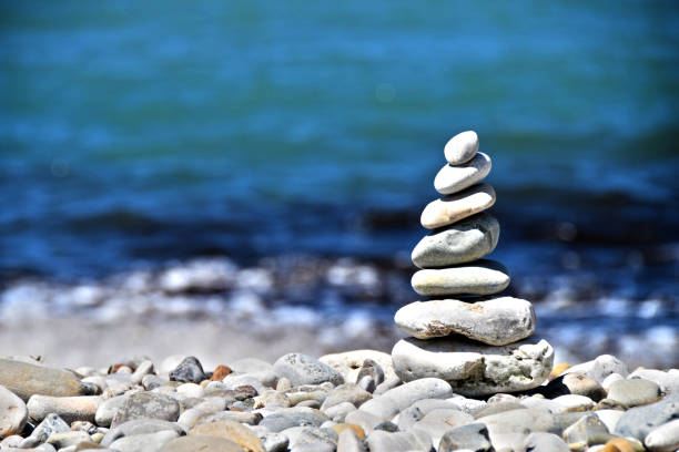 istock stone tower on the beach - stones stacked on each other 822657126