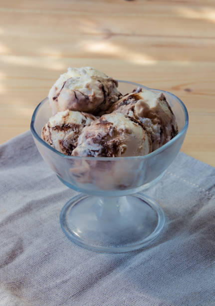 istock Vanilla ice cream scoops with chocolate sauce. Selective focus 822664448