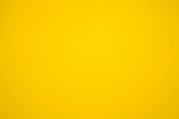 istock yellow painted wall, yellow color backgrounds 822672456