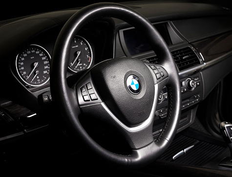 Sankt-Petersburg, Russia, January 22, 2017 : BMW passenger car interior showing steering wheel and gear shift  in black leather interior, test drive on January 22, 2017  in Russia, Sankt-Petersburg