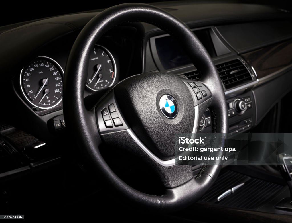 BMW passenger car interior showing steering wheel and gear shift  in black leather interior Sankt-Petersburg, Russia, January 22, 2017 : BMW passenger car interior showing steering wheel and gear shift  in black leather interior, test drive on January 22, 2017  in Russia, Sankt-Petersburg BMW Stock Photo
