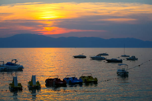istock Sunset with boats at sea 822678906