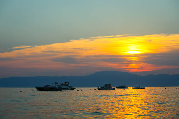 istock Sunset with boats at sea 822678936