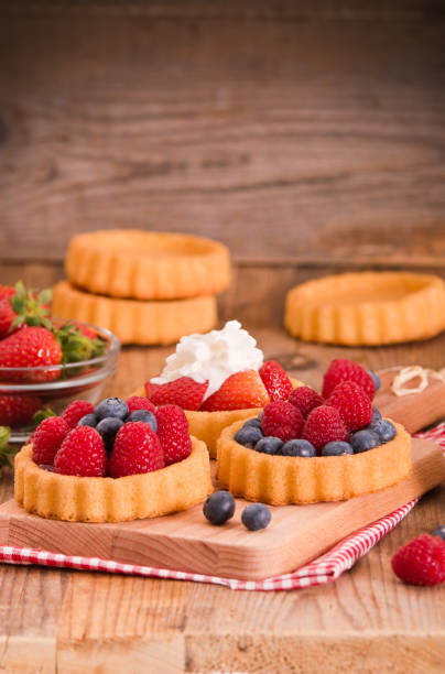 istock Tartlets with forest fruits. 822681662