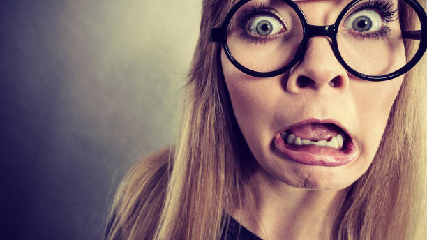 istock Closeup woman shocked face with eyeglasses 822685604