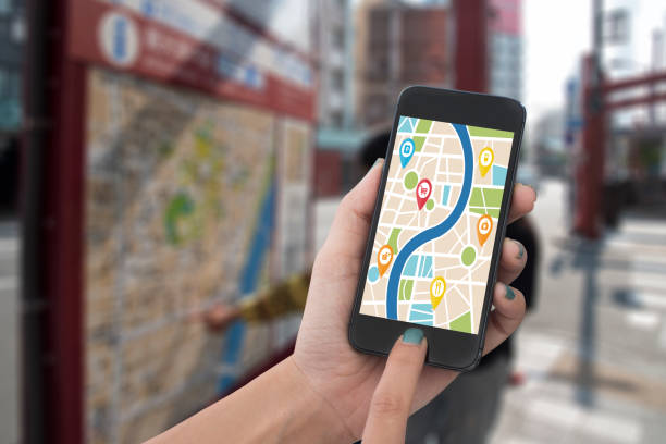 istock hand holding smart phone with map gps navigation application. concept guideline street travel 822693150