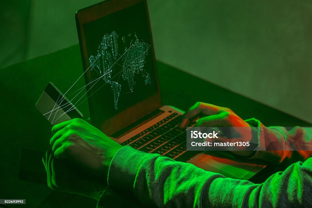 Computer E Hacker Hooded Computer Hacker Stealing Information With Laptop Stock Photo ...