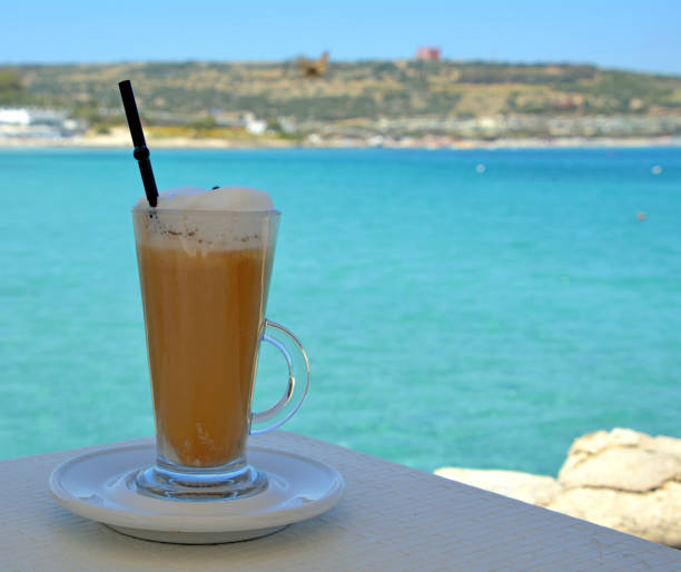 istock Delicious iced coffee on a glass on a sea background. 822694478