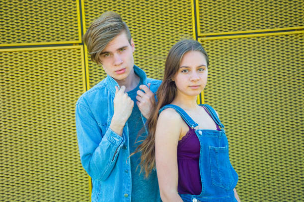 istock Pair of siblings posing together 822697024
