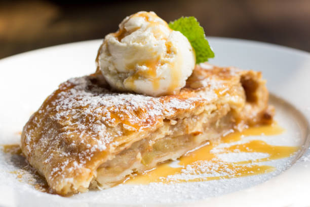 Crispy apple strudel Crispy apple strudel with ice cream ice pie stock pictures, royalty-free photos & images