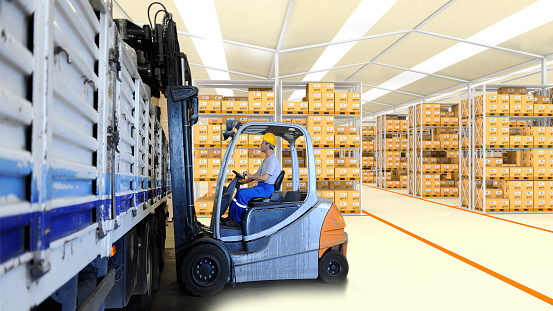 Operator Loading Box Forklift Operator Loading Boxes In Warehouse Stock Photo - Download ...