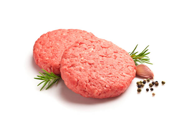 istock Raw hamburger patties against white background 822733148