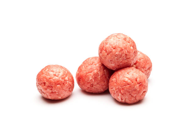 istock Raw meatballs isolated on white background 822733290