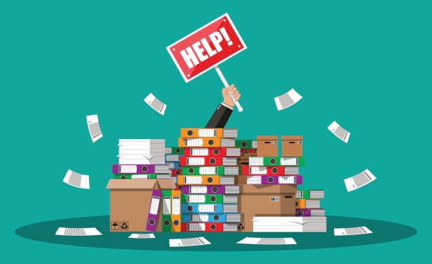 istock Businessman in pile of office papers 822738366