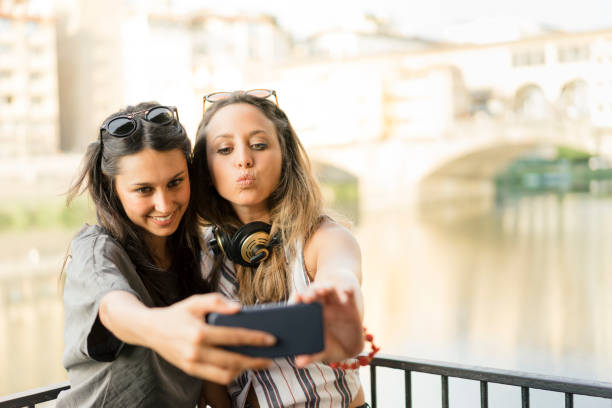 istock Two friends having selfie in the city 822738726