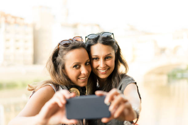 istock Two friends having selfie in the city 822738734
