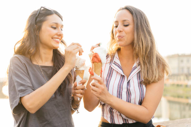istock Two friends eating ice-cream together 822738750