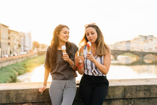 istock Two friends eating ice-cream together 822738812