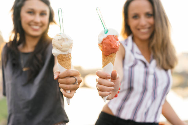 istock Two friends eating ice-cream together 822738846