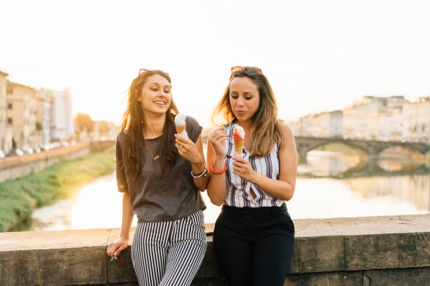 istock Two friends eating ice-cream together 822738866