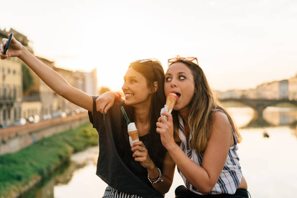 istock Two friends having selfie in the city 822738986