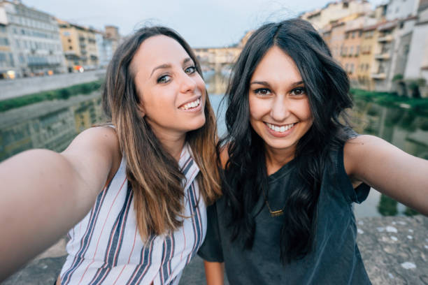 istock Two friends having selfie in the city 822739054