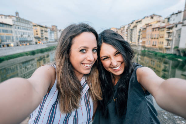 istock Two friends having selfie in the city 822739092