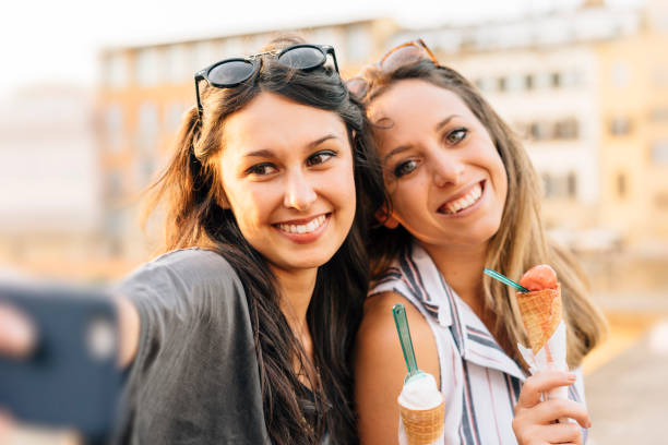 istock Two friends having selfie in the city 822739106