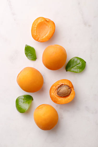 Apricots on marble background viewed from above. Fresh and healthy fruit. Top view