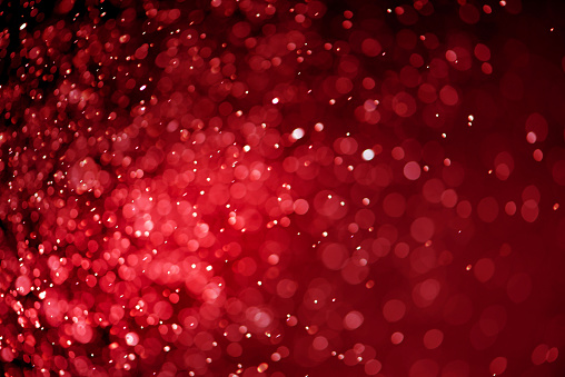 Abstract red bokeh lights background. Red bokeh lights