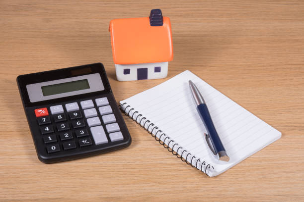 istock Model house, calculator and notebook with pen 822763760