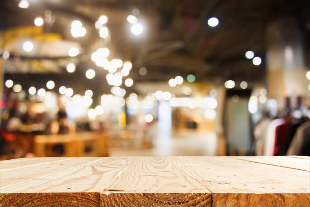 istock empty wooden table and blur department store with bokeh for background - template for product display montage and business presentation 822793676