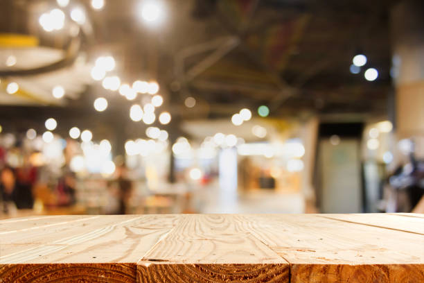 istock empty wooden table and blur department store with bokeh for background - template for product display montage and business presentation 822793734