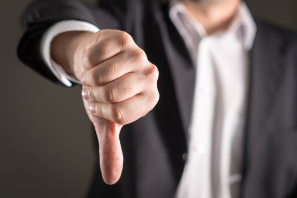 Business man showing thumbs down. stock photo