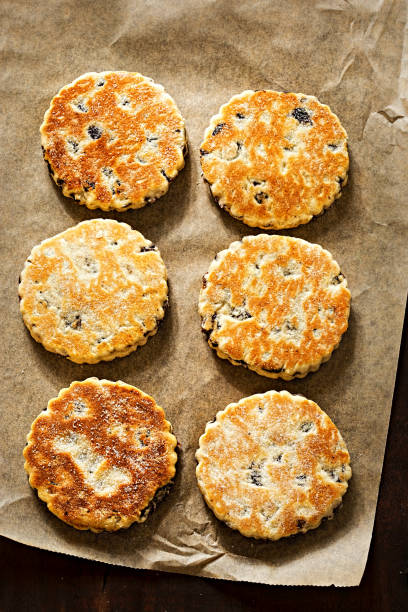 Welsh cake with currants and sugar Welsh cake with currants and sugar welsh culture stock pictures, royalty-free photos & images