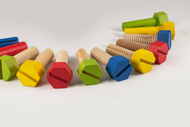 istock Colorful wooden toy bolts arranged 822814302