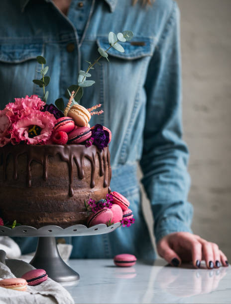 istock Wedding cake with flowers macarons and blueberries 822843650