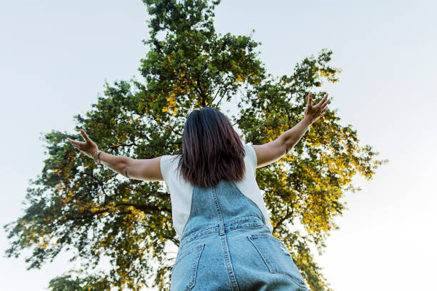 istock woman arms outstretched 822852650
