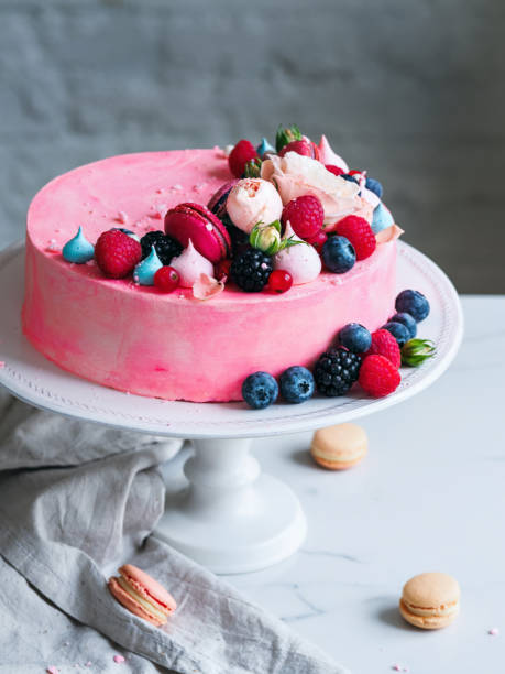 istock Wedding cake with flowers macarons and blueberries 822859278