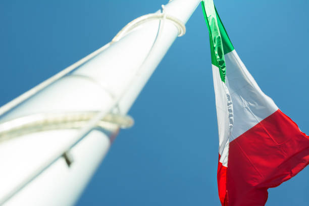 istock The Italian flag in blue sky 822867302