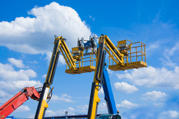 istock Lift buckets in the blue sky with clouds 822868908