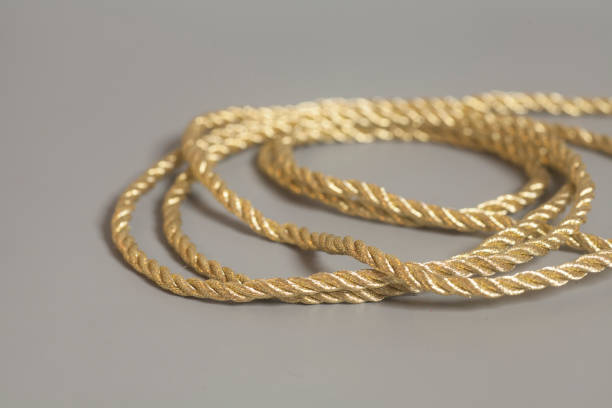 istock Golden rope on gray background 822874982