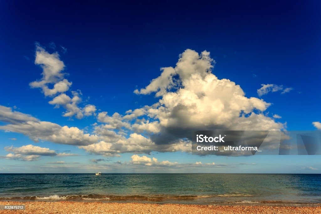 Majestic cumulus cloud above the Ionian Sea at Skala beach in Kefalonia Greece Stock Photo