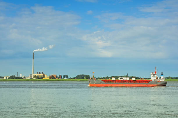 istock Freight ship on river Weser in front of city Nordenham 822875802