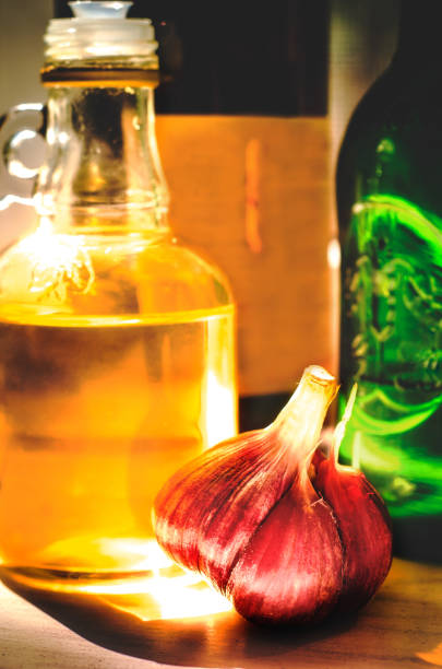 Still life with spices: garlic, olive oil and balsamic in bottles. Food photo concept