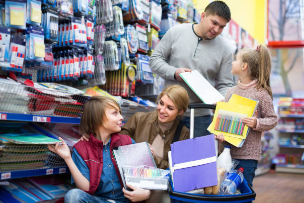 istock Family choosing stationery in store 822880840
