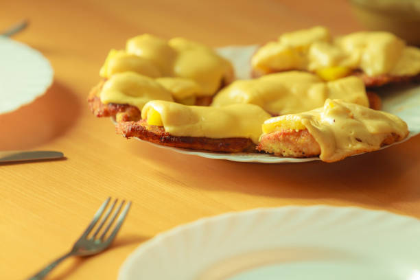 Chicken cutlet with pineapples and cheese on plate. Dinner dish meal ready to eat.