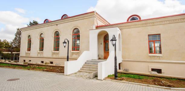 istock House with white porch in front of blue sky 822894826